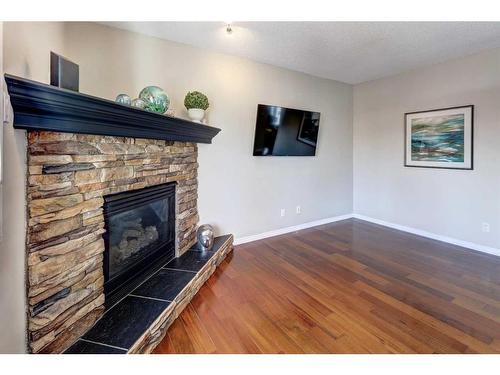 64 Valley Meadow Close Nw, Calgary, AB - Indoor With Fireplace