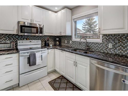 64 Valley Meadow Close Nw, Calgary, AB - Indoor Photo Showing Kitchen With Double Sink
