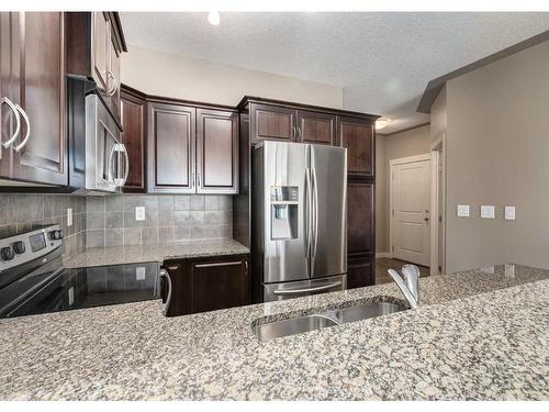 520-35 Inglewood Park Se, Calgary, AB - Indoor Photo Showing Kitchen With Double Sink