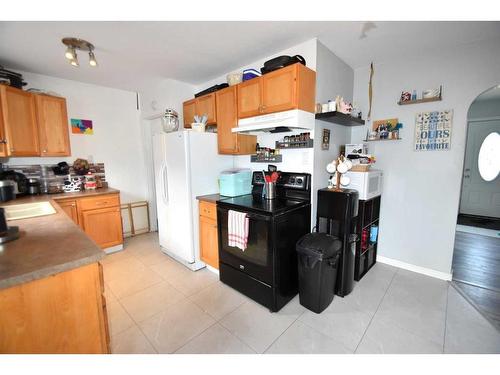4813 51 Street, Kitscoty, AB - Indoor Photo Showing Kitchen With Double Sink
