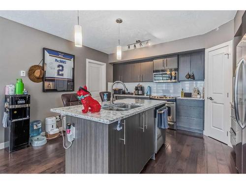 206-15207 1 Street Se, Calgary, AB - Indoor Photo Showing Kitchen With Stainless Steel Kitchen With Double Sink With Upgraded Kitchen