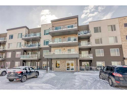 305-200 Shawnee Square Sw, Calgary, AB - Outdoor With Balcony With Facade