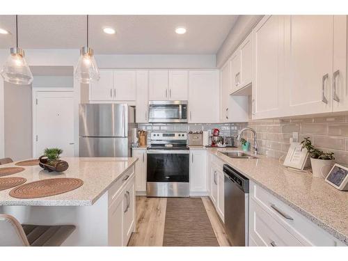 305-200 Shawnee Square Sw, Calgary, AB - Indoor Photo Showing Kitchen With Upgraded Kitchen