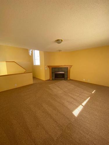 65 Scotia Point Nw, Calgary, AB - Indoor With Fireplace