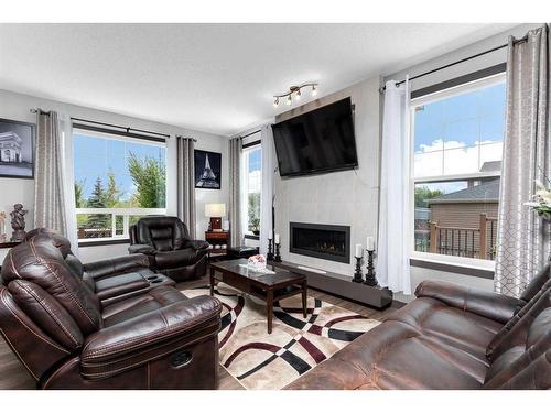 53 Legacy Gate Se, Calgary, AB - Indoor Photo Showing Living Room With Fireplace