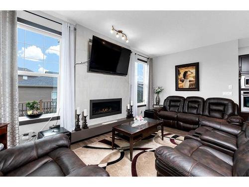 53 Legacy Gate Se, Calgary, AB - Indoor Photo Showing Living Room With Fireplace