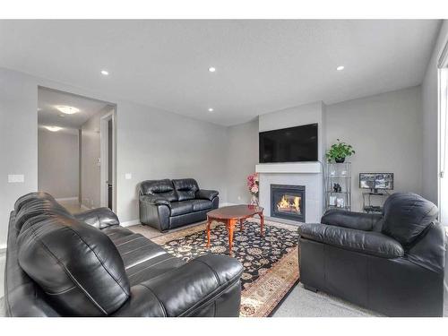 245 Aspenmere Way, Chestermere, AB - Indoor Photo Showing Living Room With Fireplace