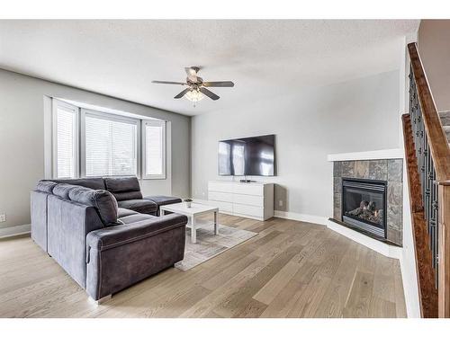 333 Bayside Place Sw, Airdrie, AB - Indoor Photo Showing Living Room With Fireplace
