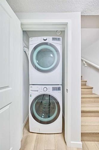 67 Seton Villas Se, Calgary, AB - Indoor Photo Showing Laundry Room