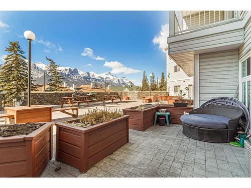 101-1080A Cougar Creek Drive, Canmore, AB - Outdoor With Deck Patio Veranda With Exterior