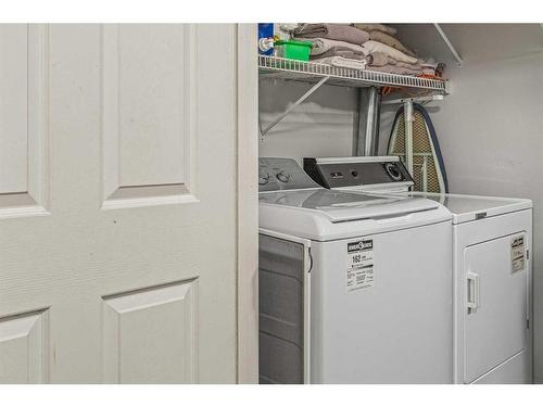 101-1080A Cougar Creek Drive, Canmore, AB - Indoor Photo Showing Laundry Room