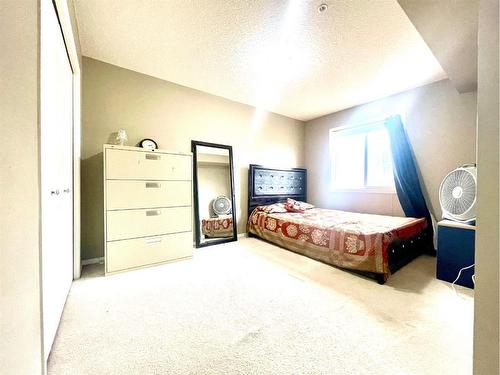 203-5 Saddlestone Way Ne, Calgary, AB - Indoor Photo Showing Bedroom