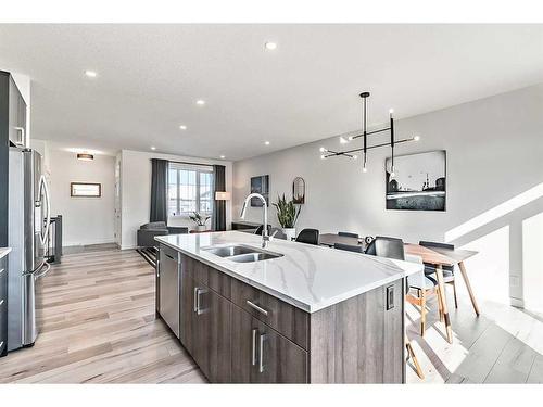 195 Riverwood Crescent, Diamond Valley, AB - Indoor Photo Showing Kitchen With Double Sink With Upgraded Kitchen