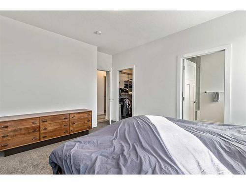 195 Riverwood Crescent, Diamond Valley, AB - Indoor Photo Showing Bedroom
