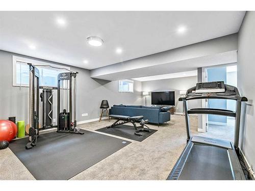 195 Riverwood Crescent, Diamond Valley, AB - Indoor Photo Showing Gym Room