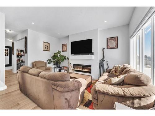 974 Bayview Rise Sw, Airdrie, AB - Indoor Photo Showing Living Room With Fireplace
