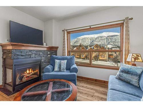 110-80 Dyrgas Gate, Canmore, AB - Indoor Photo Showing Living Room With Fireplace