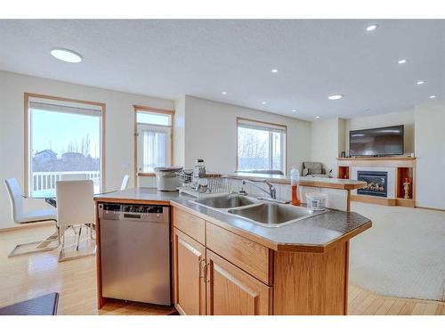 47 Taralea Place Ne, Calgary, AB - Indoor Photo Showing Kitchen With Fireplace With Double Sink