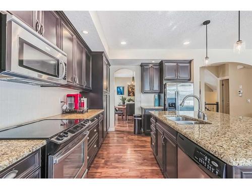 128 Mike Ralph Way Sw, Calgary, AB - Indoor Photo Showing Kitchen With Double Sink With Upgraded Kitchen