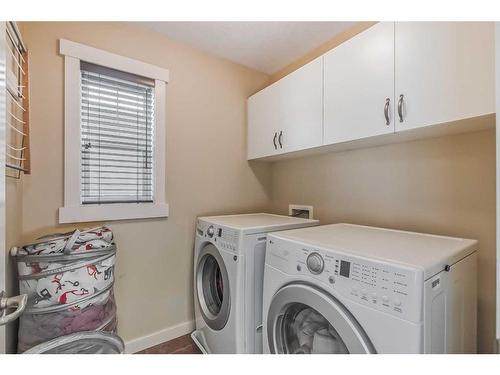 128 Mike Ralph Way Sw, Calgary, AB - Indoor Photo Showing Laundry Room