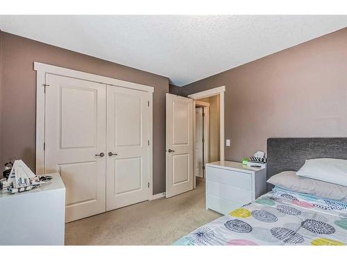 128 Mike Ralph Way Sw, Calgary, AB - Indoor Photo Showing Bedroom