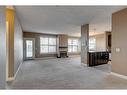 106-88 Arbour Lake Road Nw, Calgary, AB  - Indoor With Fireplace 