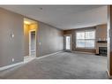 106-88 Arbour Lake Road Nw, Calgary, AB  - Indoor With Fireplace 