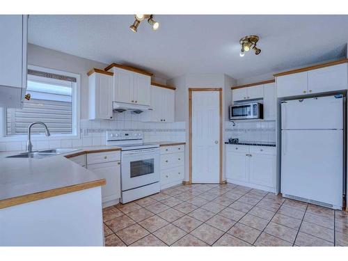 71 Taracove Crescent Ne, Calgary, AB - Indoor Photo Showing Kitchen With Double Sink