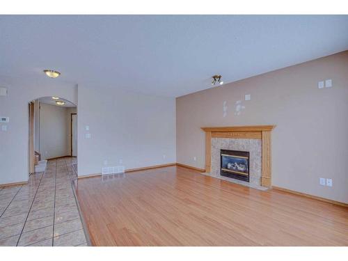 71 Taracove Crescent Ne, Calgary, AB - Indoor Photo Showing Living Room With Fireplace