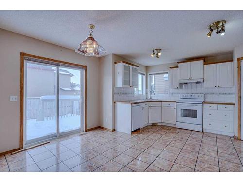 71 Taracove Crescent Ne, Calgary, AB - Indoor Photo Showing Kitchen With Double Sink