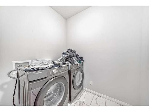 64 Cityside Common Ne, Calgary, AB - Indoor Photo Showing Laundry Room