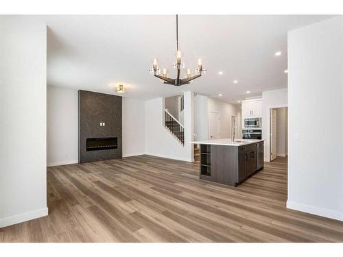 328 Legacy Reach Circle, Calgary, AB - Indoor Photo Showing Other Room With Fireplace