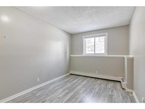 105A-5601 Dalton Drive Nw, Calgary, AB - Indoor Photo Showing Other Room