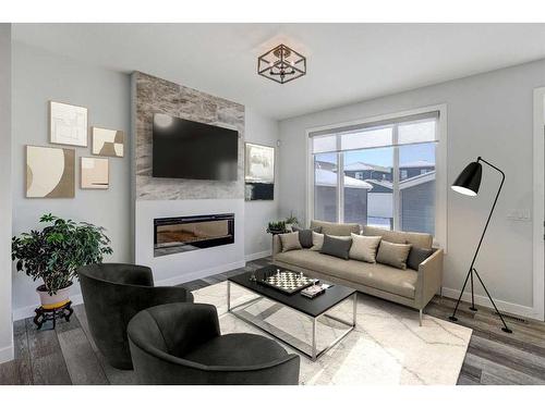 224 Chelsea Manor, Chestermere, AB - Indoor Photo Showing Living Room With Fireplace