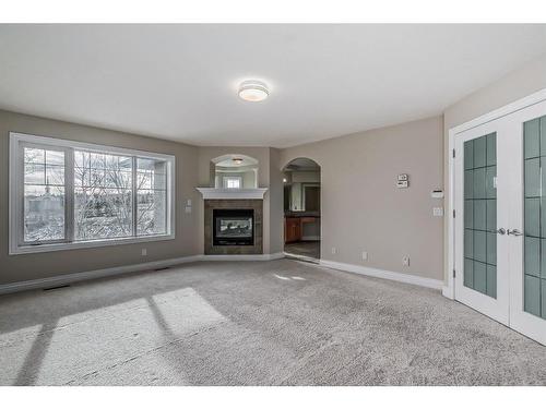 142 Panatella Circle Nw, Calgary, AB - Indoor Photo Showing Living Room With Fireplace