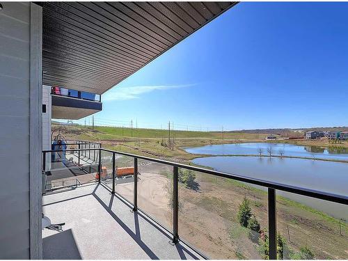 2208-42 Cranbrook Gardens Se, Calgary, AB - Outdoor With Body Of Water With Balcony With View