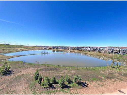 2208-42 Cranbrook Gardens Se, Calgary, AB - Outdoor With Body Of Water With View