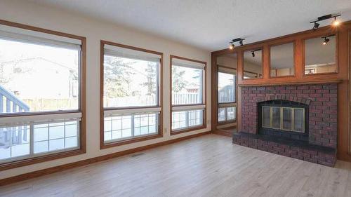 44 Edgeridge Way Nw, Calgary, AB - Indoor Photo Showing Living Room With Fireplace
