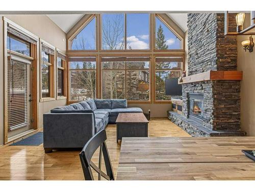 201-75 Dyrgas Gate, Canmore, AB - Indoor Photo Showing Living Room With Fireplace