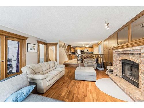 44 Shawnee Way Sw, Calgary, AB - Indoor Photo Showing Living Room With Fireplace