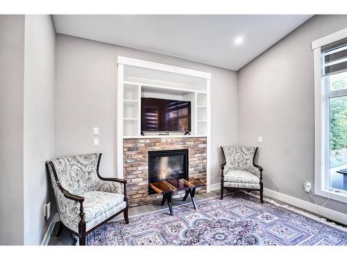 1025 2 Avenue Nw, Calgary, AB - Indoor With Fireplace