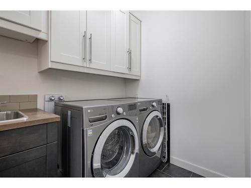 129 Springbluff Boulevard Sw, Calgary, AB - Indoor Photo Showing Laundry Room