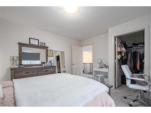 129 Springbluff Boulevard Sw, Calgary, AB - Indoor Photo Showing Bedroom