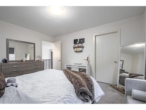 129 Springbluff Boulevard Sw, Calgary, AB - Indoor Photo Showing Bedroom