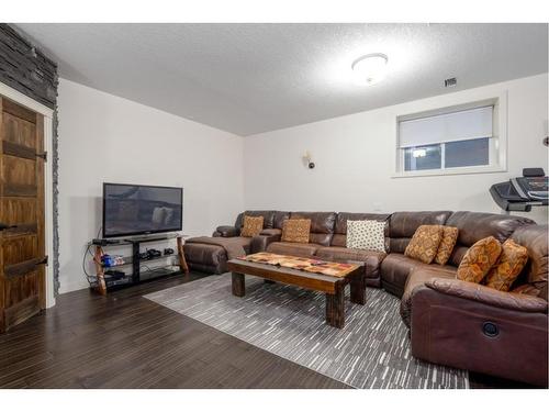 129 Springbluff Boulevard Sw, Calgary, AB - Indoor Photo Showing Living Room