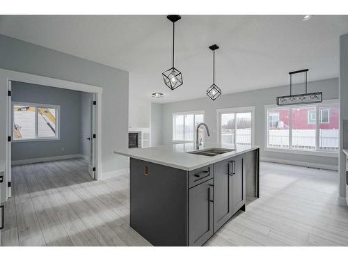 1439 Scarlett Ranch Boulevard, Carstairs, AB - Indoor Photo Showing Kitchen With Double Sink