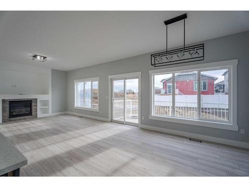 1439 Scarlett Ranch Boulevard, Carstairs, AB - Indoor With Fireplace