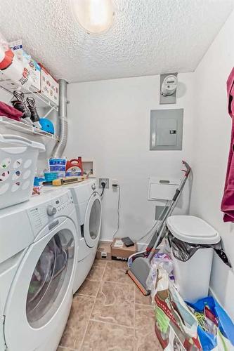 1213-8710 Horton Road Sw, Calgary, AB - Indoor Photo Showing Laundry Room