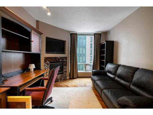 505-837 2 Avenue Sw, Calgary, AB - Indoor Photo Showing Living Room With Fireplace