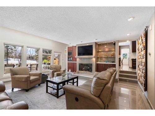 10931 Willowfern Drive Se, Calgary, AB - Indoor Photo Showing Living Room With Fireplace